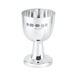 Silver egg cup with engraved hallmarks on a white background