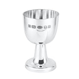 Silver egg cup with engraved hallmarks on a white background