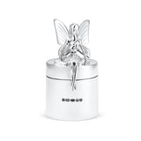 Silver fairy figurine on top of a silver container with hallmarks on a white background.