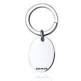 Silver oval keyring with hallmarks on a white background