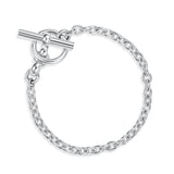 Silver chain bracelet with a t-bar clasp on a white background