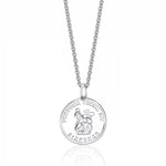 Silver sixpence pendant necklace on a white background