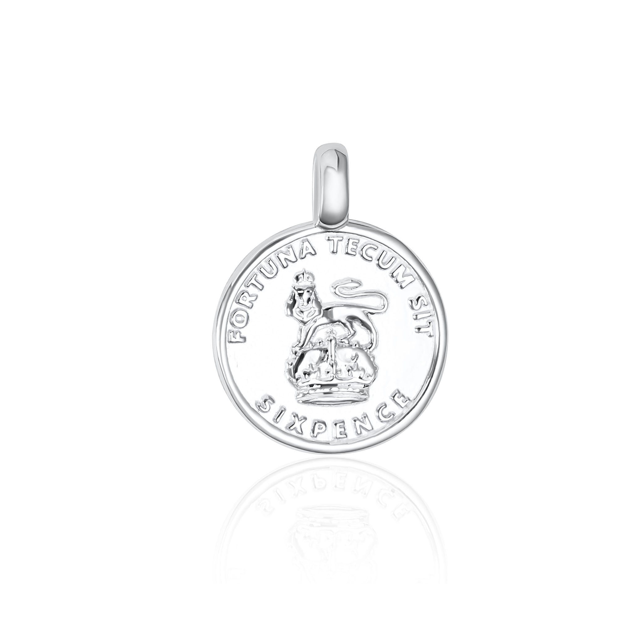 Silver pendant with engraved design on a white background