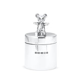 Silver bear figurine on top of a silver container with hallmarks on a white background.
