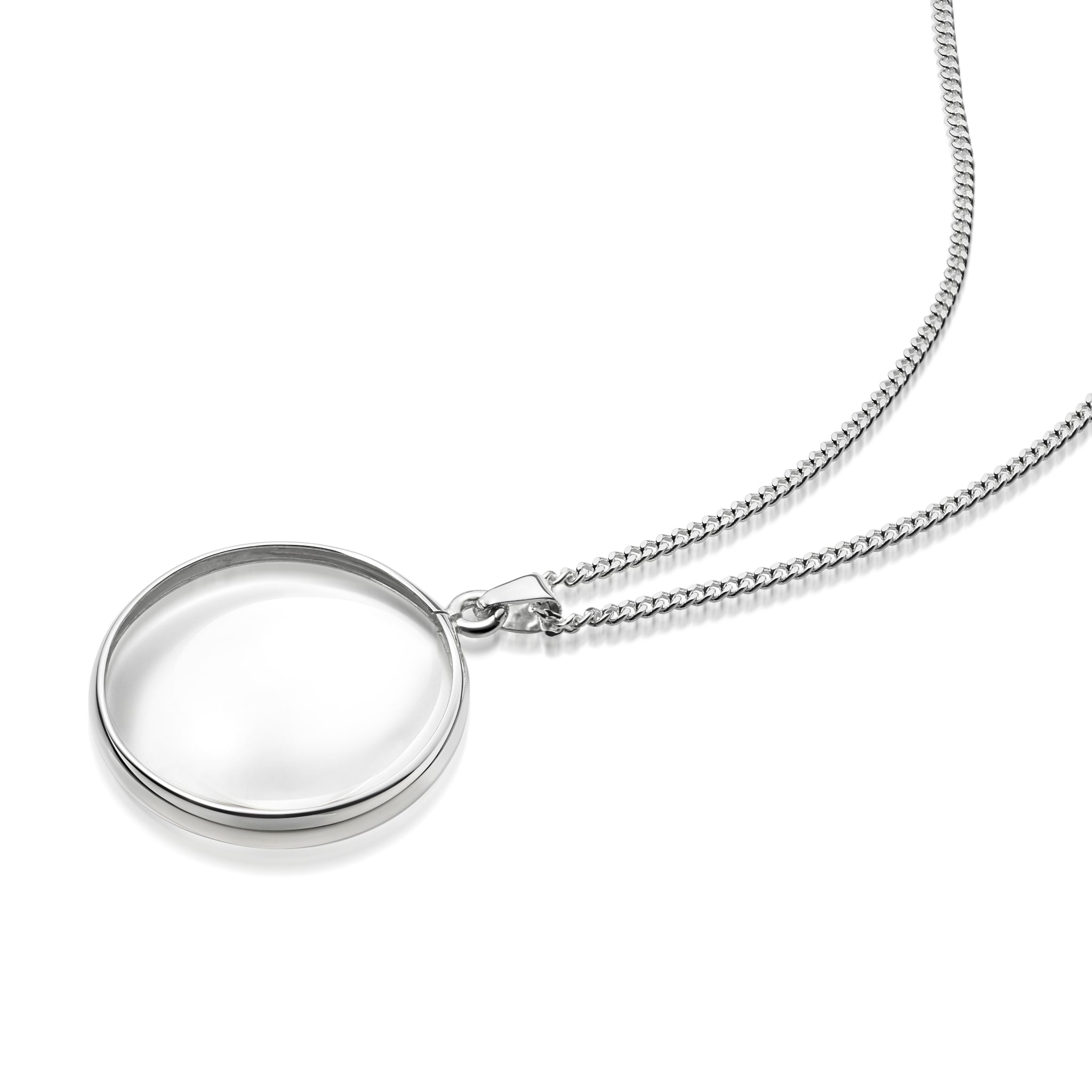 A silver  necklace with a round magnifying pendant on a curb chain, shown on a clean white background. 