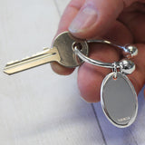 Sterling silver twist ball keyring in hand