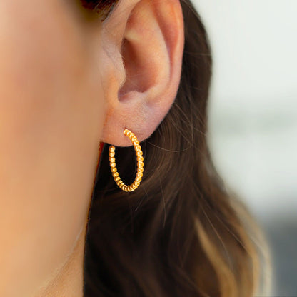 Slim gold and silver ball hoop earring 