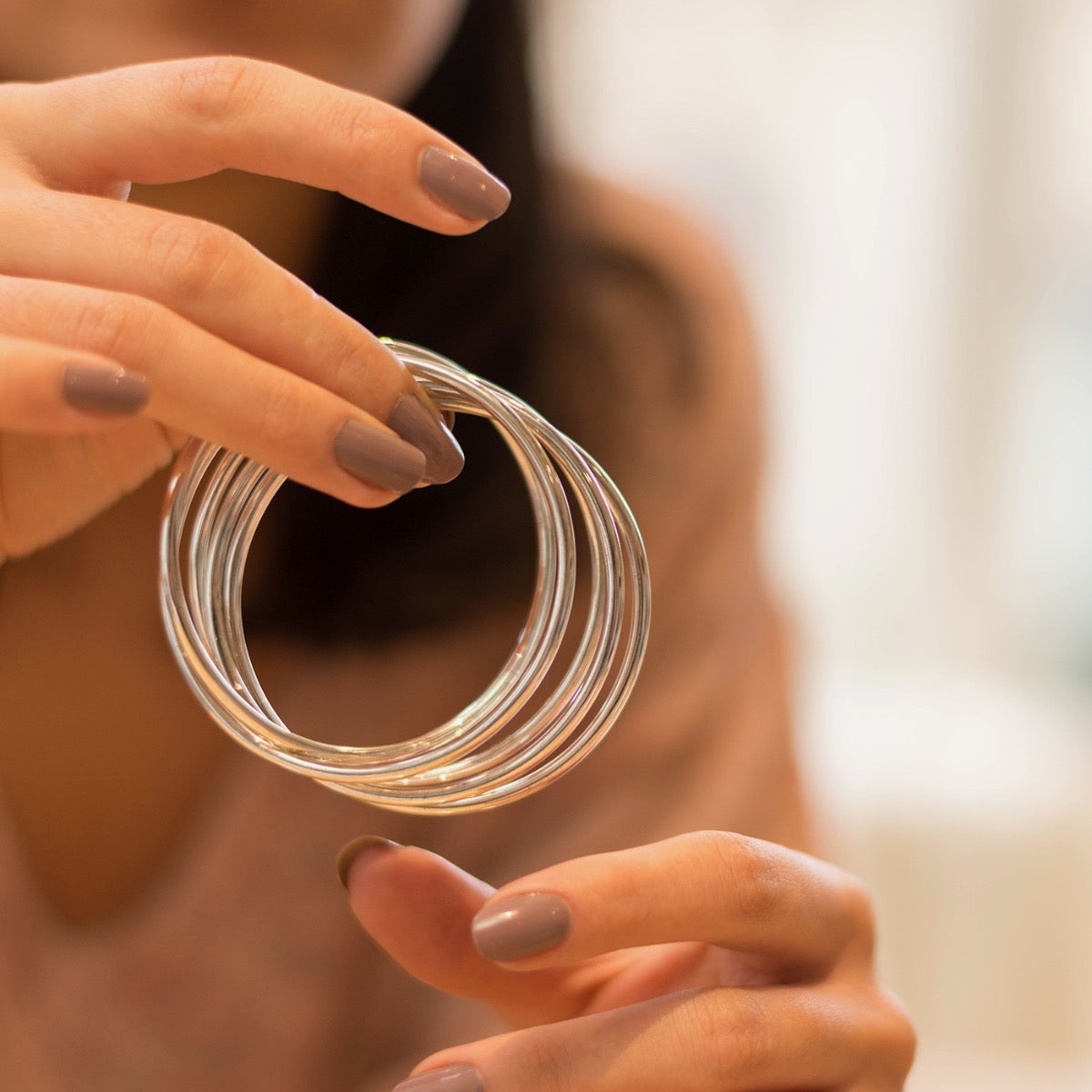 five silver bangles