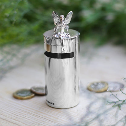 Silver money box with fairy on top 