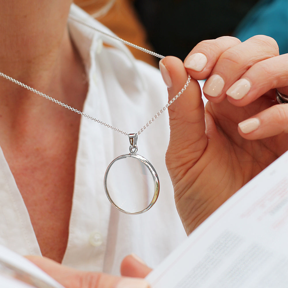 Magnifying glass on silver necklace 