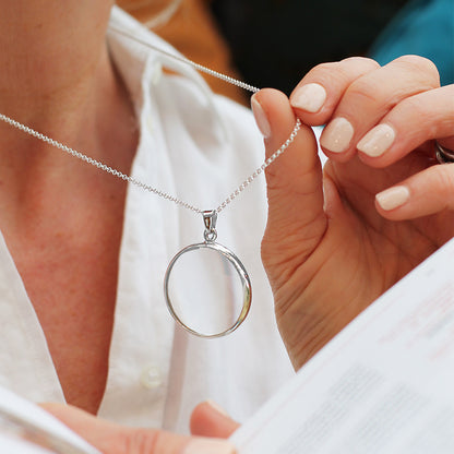 Magnifying glass on silver necklace 