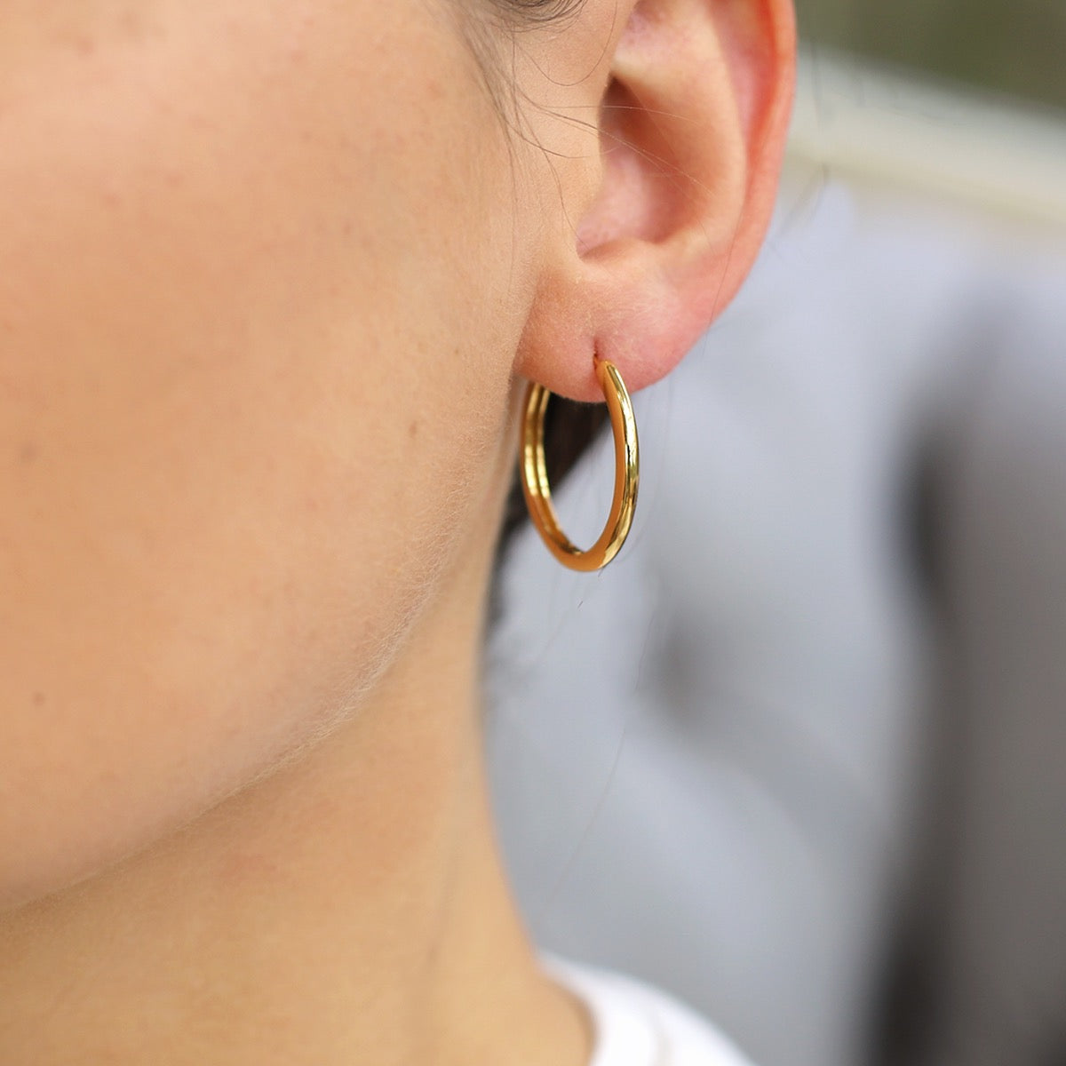 Medium silver and gold huggie hoop earring
