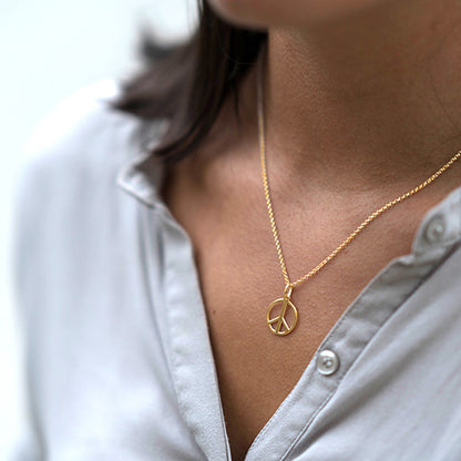 Gold peace necklace