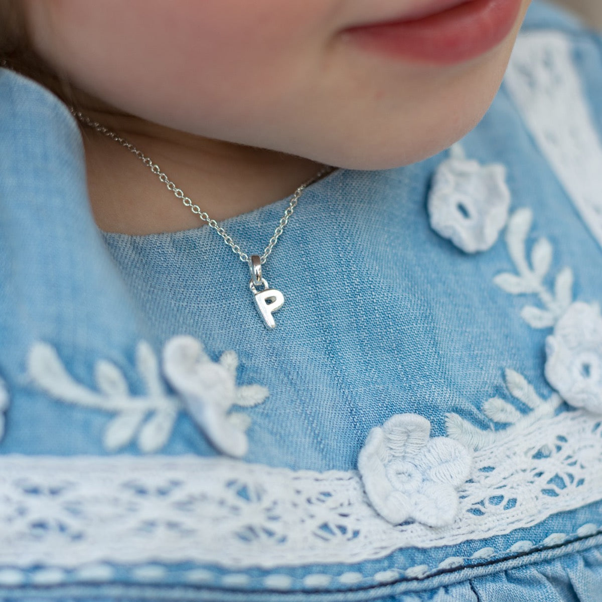 Silver letter P necklace worn
