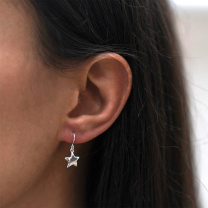 silver star drop earrings