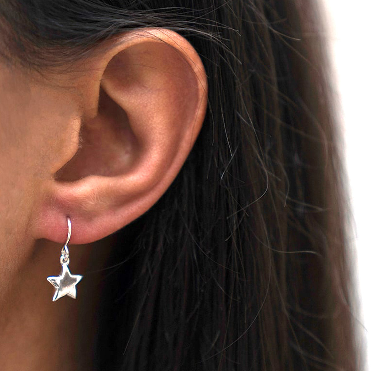 silver star drop earrings