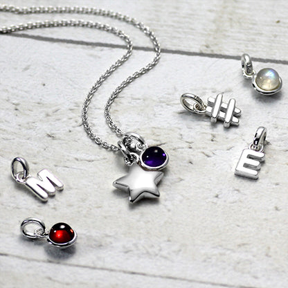 Silver star necklace with charms