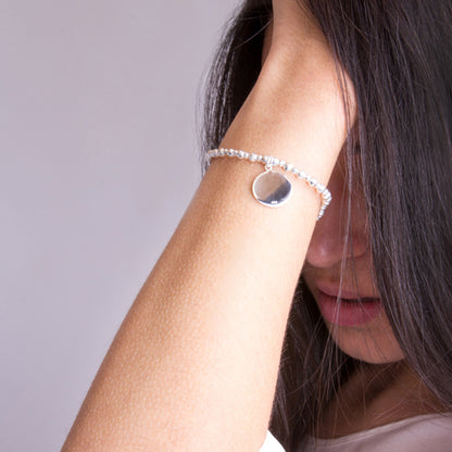 Silver bracelet with disc on model