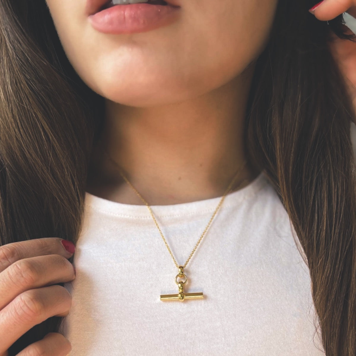 Gold plated T bar necklace on chain
