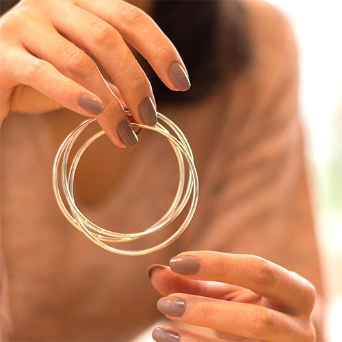 Three silver bangles 
