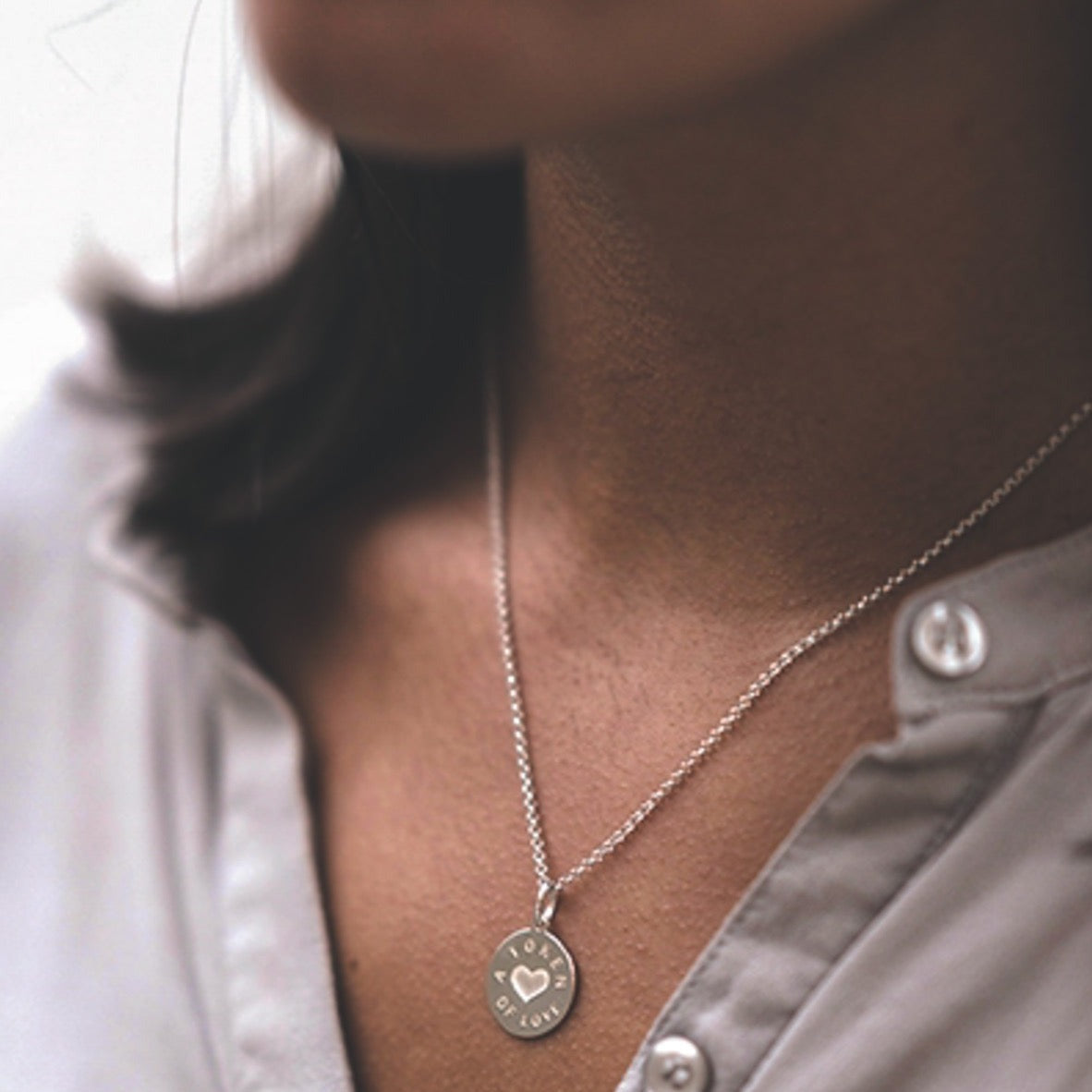 Silver token of love necklace